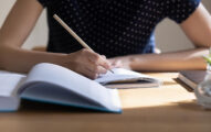 Young Student Girl Writing Notes